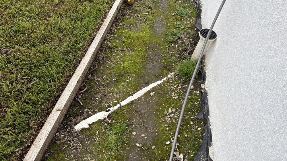 Stormwater pipes laid shallow at the rear of the dwelling, found during a defect investigation in Herne Hill