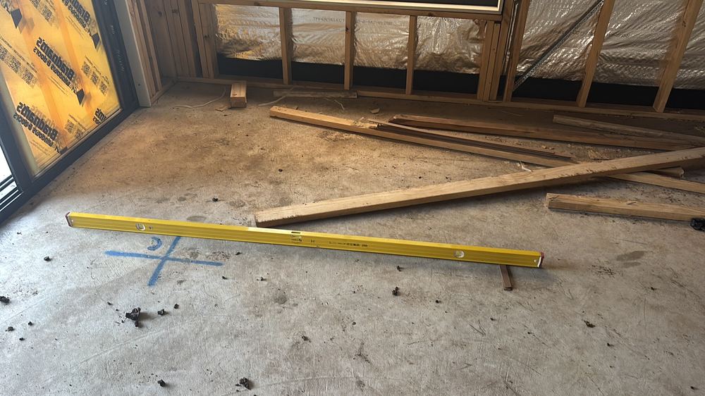Slab out of level beyond the 10mm per room tolerance, Hoppers Crossing, found during a lock-up inspection in Mambourin