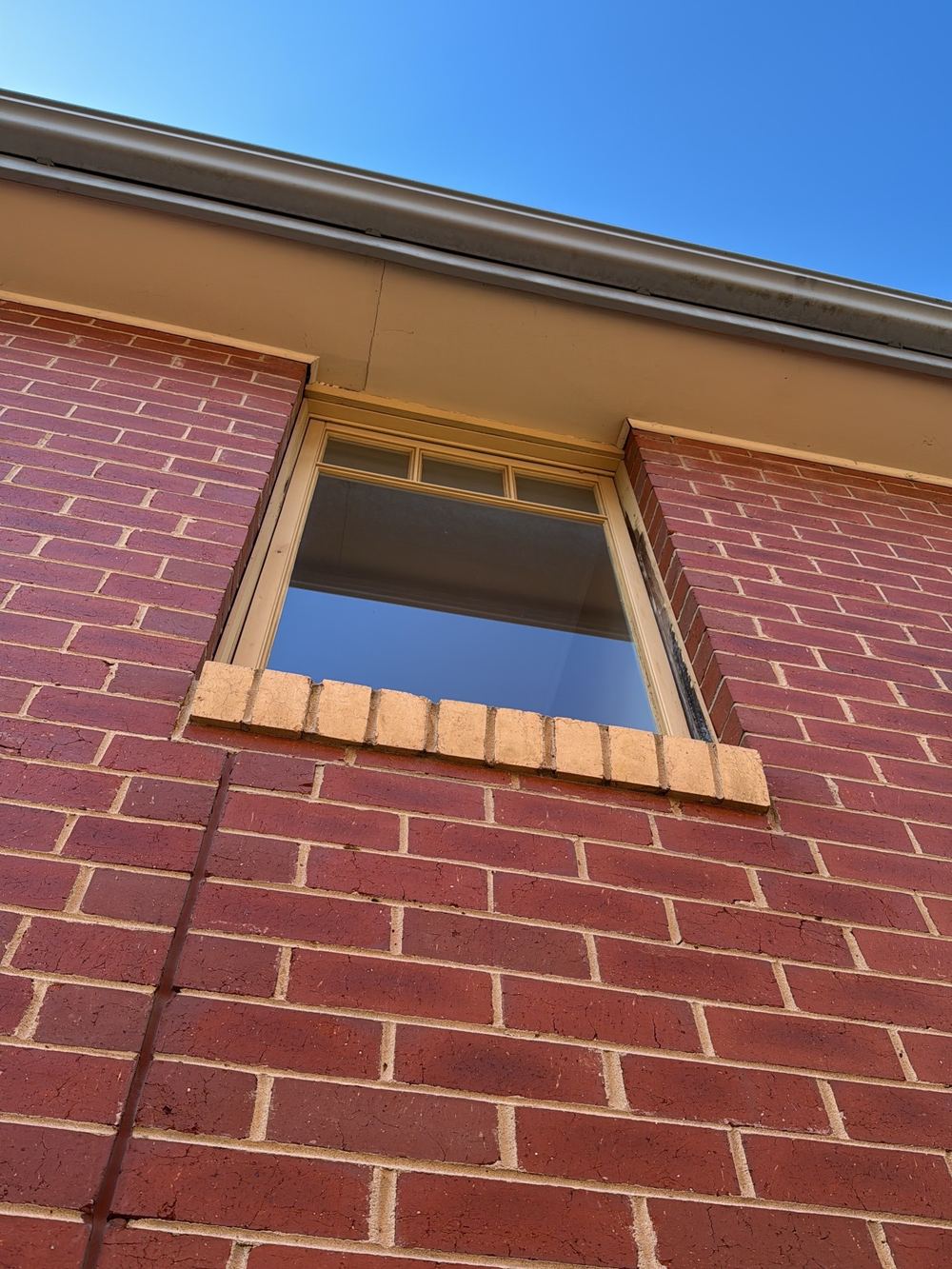 Bedroom window cut down so it would open, a sign of movement, found during a pre-purchase inspection in Newport